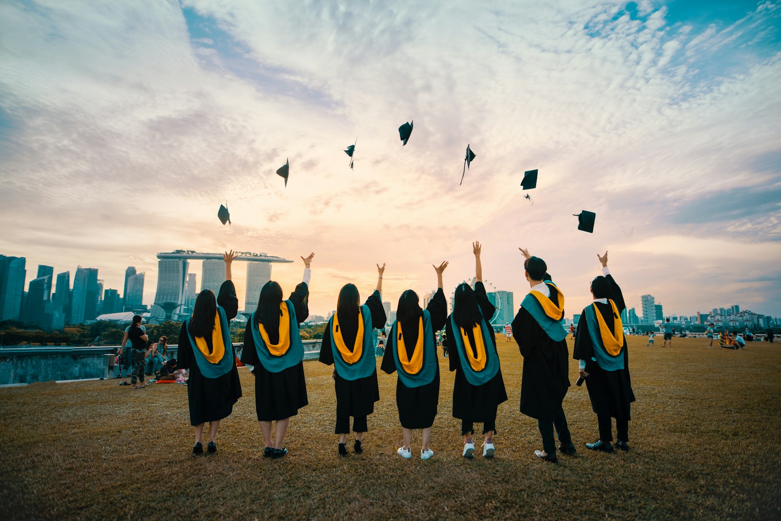 University graduates celebrating together outdoors